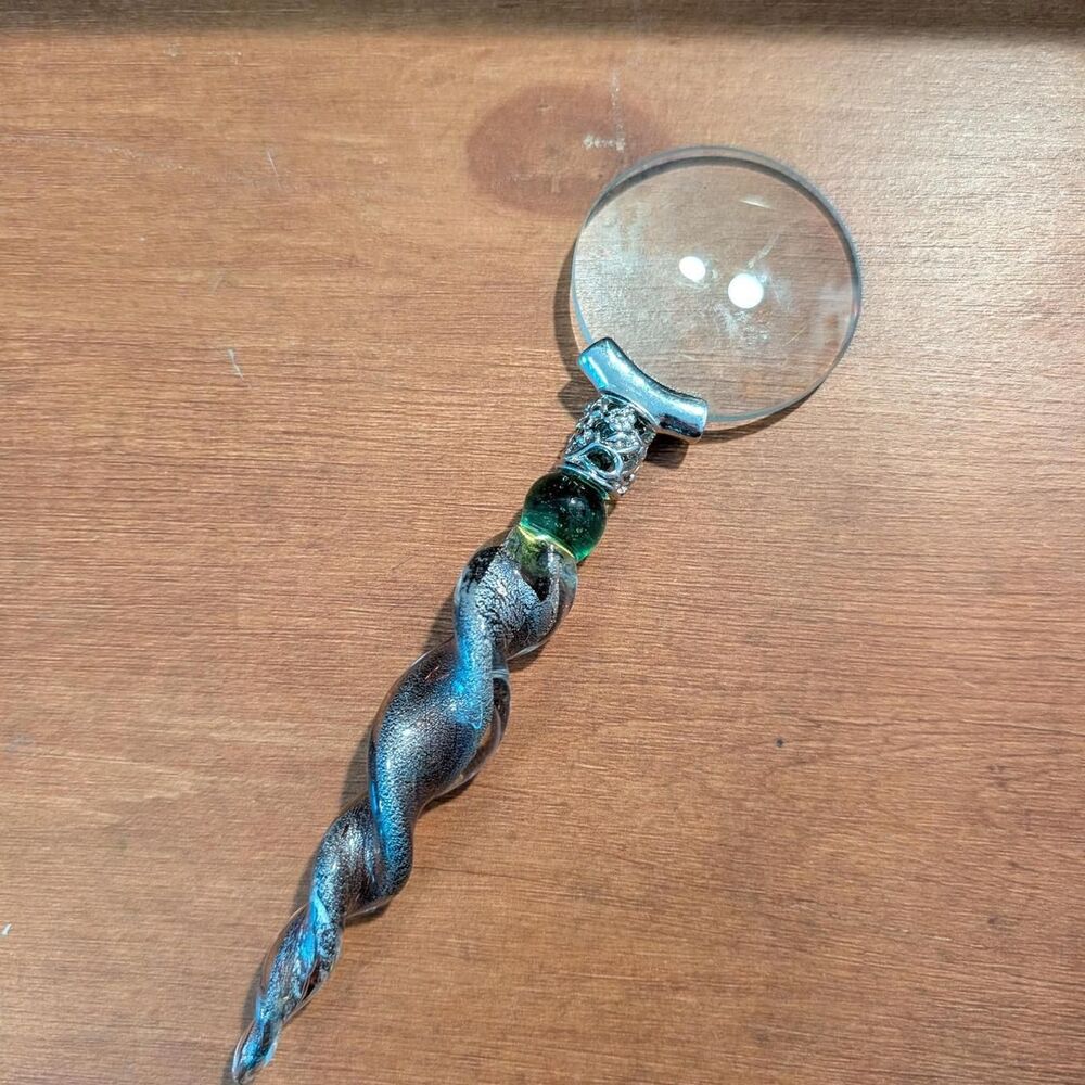 Silver and Green Magnifying Glass